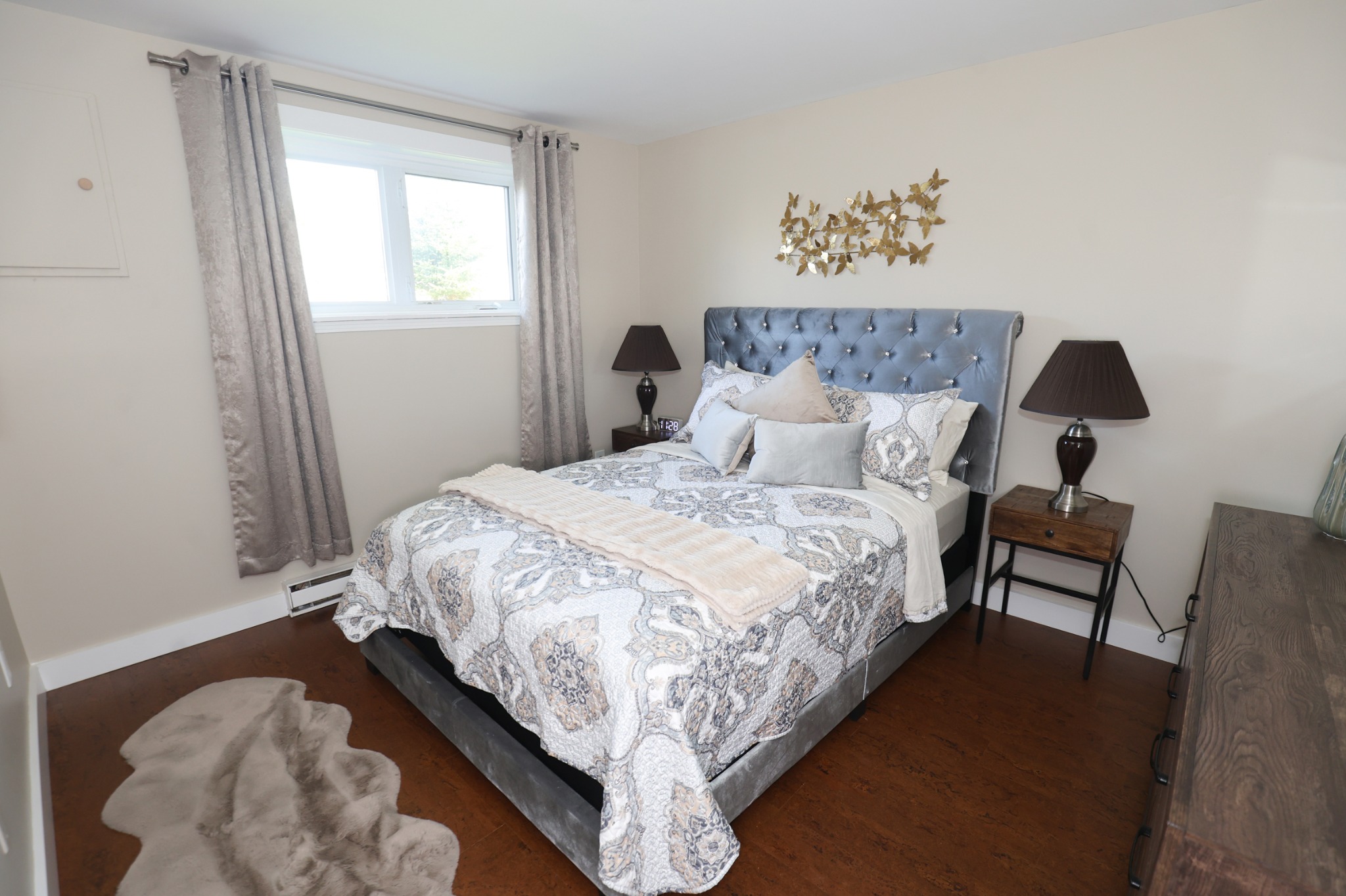 Comfortable silver bedroom at Doyle's Haven