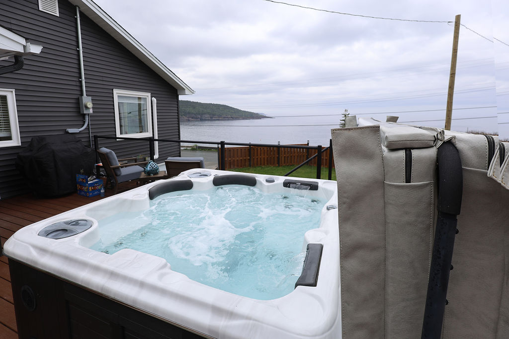 Private hot tub overlooking the water at The Harbour House